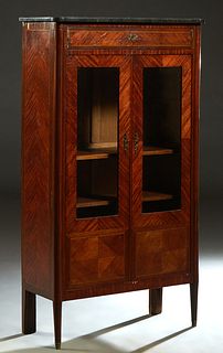 French Louis XVI Style Inlaid Mahogany Marble Top Bookcase, early 20th c., the ogee edge cookie corner marble over a frieze drawer above double doors 