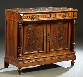 French Henri II Style Carved Walnut Marble Top Sideboard, c. 1880, the inset highly figured brown marble over a long frieze drawer above double setbac