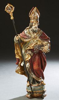Continental Polychromed Terracotta Figure, of St. Urban of Langres, wearing a Bishop's mitre and holding a bishop's staff in his right hand, and a boo