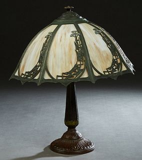 American Patinated Spelter Art Nouveau Lamp, early 20th c., with an eight panel curved caramel slag glass shade, H.- 19 1/2 in., Dia.- 16 1/2 in. Prov