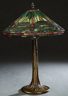Tiffany Style Leaded Glass Dragonfly Lamp, late 20th c., the peaked slag glass shade atop a gilt patinated metal tree form base, H.- 22 1/2 in, Dia.- 