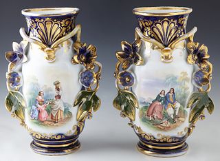 Pair of Old Paris Cobalt Porcelain Baluster Vases, 20th c., with applied leaf and floral handles, with gilt decoration overall, one side with a reserv