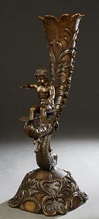 Large Bronze Cornucopia Vase, 20th/21st c., with a seated putto and a dragonfly in front of the vase, on a relief rounded square base, H.- 30 3/4 in.,