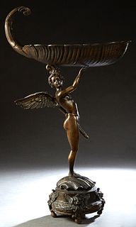 Patinated Bronze Garden Figure, 20th c., of a nude putto warrior upholding a large shell, perhaps a bird bath, on a relief shell circular base on four