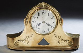 Brass Napoleon Hat Mantel Clock, late 19th c., the arched top over a steel dial time and strike drum clock, above a beveled glass triangular insert, f