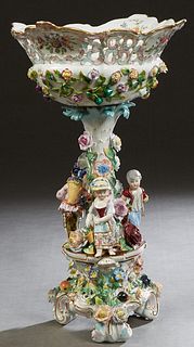Meissen Style Porcelain Figural Compote, early 20th c., by Carl Thieme, the bottom marked with crossed swords over a "T," the reticulated circular bas