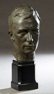 Patinated Bronze Bust of a Man, 20th c., unsigned, on a stepped black marble base, Bust- H.- 12 in., Total H.- 18 1/2 in., W.- 6 in., D- 7 in. Provena