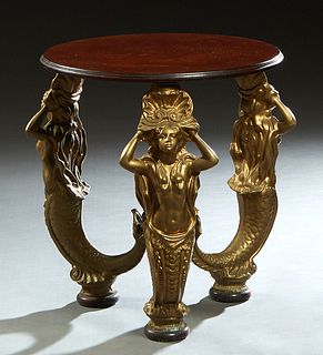 Unusual Carved Mahogany Occasional Table, 20th c., the stepped circular top on three gilt metal mermaid supports on mahogany disc feet, joined by a ce