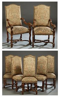 Set of Eight (6 +2) Carved Beech Dining Chairs, early 20th c., the high arched canted cushioned back over a cushioned seat, on cabriole legs joined by