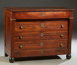 French Louis Philippe Carved Mahogany Commode, 19th c., the rectangular top over a long frieze drawer, above three setback drawers, flanked by curved 