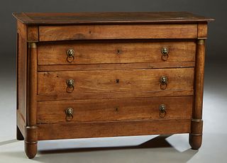 French Empire Ormolu Mounted Carved Walnut Commode, c. 1840, the rectangular top over a long frieze drawer and three setback deep drawers flanked by e