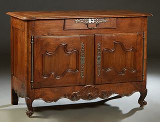 French Louis XV Style Elm and Cherry Sideboard, 19th c., the stepped segmented rounded corner ogee edge top over a center drawer with a long steel pul