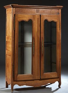 French Louis XV Style Carved Cherry Armoire, 19th c., the stepped rounded edge crown over double glazed doors with brass fiche hinges and escutcheons,