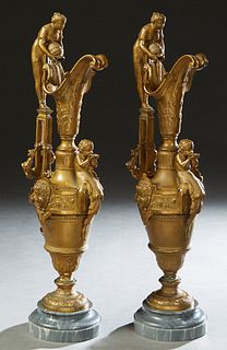 Pair of Gilt Spelter Renaissance Style Figural Ewers, late 19th c., the handle with a classical maiden water bearer surmount, over a baluster urn body