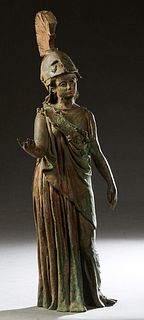 Continental School, "Standing Figure of Helmeted Athena," early 20th c., in a full length gown, her right hand extended, patinated bronze figure, H.- 