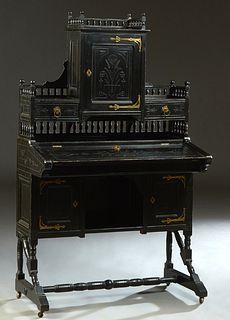American Aesthetic Ebonized Cherry Brass Mounted Secretary Desk, c. 1880, with a central spindled gallery incised cupboard, flanked by spindled galler