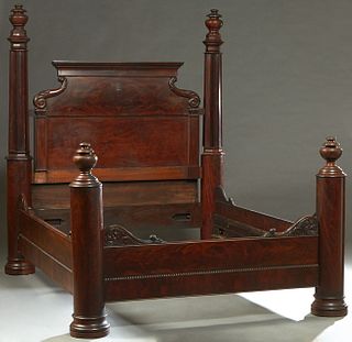 Southern Carved Mahogany New Orleans Bed, 19th c., with a scroll mounted headboard, flanked by octagonal ogee carved round posts, to floral carved woo