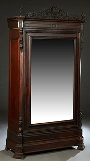 New Orleans Carved Mahogany Rococo Single Door Armoire, mid 19th c., possibly William Mccracken, with a pierced carved shell form crest flanked by two