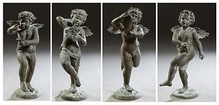 Group of Four Patinated Bronze Garden Figures, of musical putti, 20th c., one with a tambourine, one with cymbals, and one a horn, on integral stepped