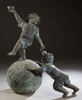 Large Patinated Bronze Fountain Figure, 20th c., of a boy standing on a large soccer ball, which is being pushed by another boy at the base, H.-53 in.