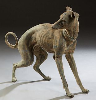 Patinated Bronze Figure of a Whippet, 20th c., H.- 30 1/2 in., W.- 36 in., D.- 13 1/2 in. Provenance: Palmira, the Estate of Sarkis Kaltakdjian (Sarki
