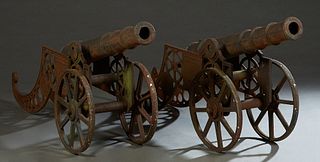 Pair of Cast Iron Garden Cannons, 20th c., with a pierced iron carriage, H.- 29 in. W.- 15 in., D.- 64 in. (2 Pcs.) Provenance: Palmira, the Estate of