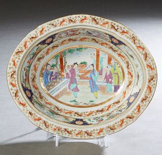 Chinese Oval Porcelain Bowl, 19th c., the flat everted rim with gold fish decoration, above a band of dragons and birds, and a lower band of goldfish,