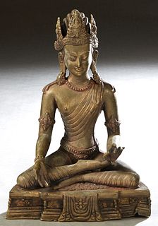Patinated Bronze Seated Buddha Figure, 20th c., on an integral stepped rounded base, H.- 13 1/2 in., W.- 9 1/2 in., D.- 5 1/2 in. Provenance: Palmira,
