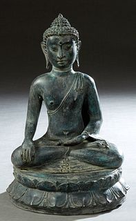 Chinese Patinated Bronze Seated Buddha Figure, 20th c., on a double lotus throne, H.- 14 in., Dia.- 8 1/2 in. Provenance: Palmira, the Estate of Sarki