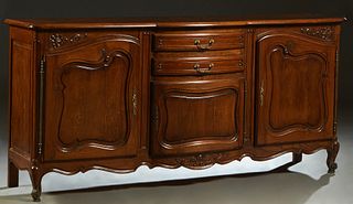 French Louis XV Style Carved Oak Sideboard, 20th c., the stepped rounded corner parquetry inlaid rectangular bowfront top over a center bank of two bo