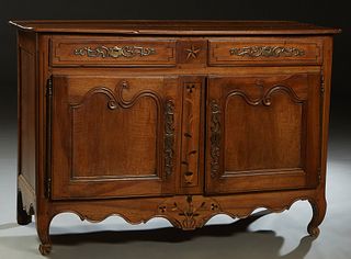 French Provincial Inlaid Carved Walnut Louis XV Style Sideboard, 19th c., the ogee edge rectangular top over two long frieze drawers with iron escutch