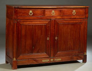 French Empire Ormolu Mounted Carved Cherry Sideboard, c. 1840, the rectangular top over three frieze drawers with swans head pulls, over two fielded p