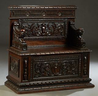 French Renaissance Style Highly Carved Pine Bench/Coffer, 19th c., the figural and floral carved back flanked by winged gryphon arms, over a lift seat