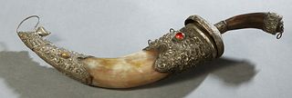 Arabic Metal Mounted Dagger or Jambiya, 20th c., with a horn handle over a horn scabbard, with an ornate metal top and bottom, mounted with cabochon a