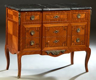 French Louis XV Style Inlaid Mahogany Marble Top Commode, 20th c., the highly figured canted corner black marble over a frieze drawer and two deep dra