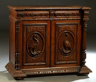 French Provincial Henri II Style Carved Oak Server, c. 1880, the breakfront top over two frieze drawers above setback double cupboard doors with high 