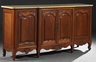 French Carved Mahogany Louis XV Style Marble Top Sideboard, 20th c., the stepped rounded edge bowed ocher marble over two central fielded panel cupboa