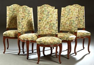 Set of Six Louis XV Style Carved Cherry Dining Chairs, 20th c., the arched high canted upholstered back over an upholstered bowed seat, on acanthus ca