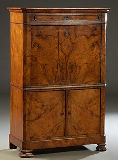 French Louis Philippe Carved Cherry Secretary Abattant, 19th c., the canted corner rectangular top over a frieze drawer, above a drop front desk with 