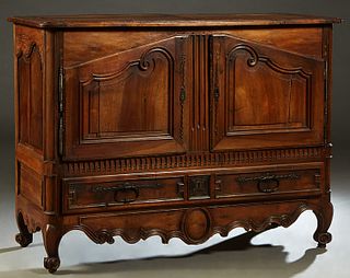 French Provincial Louis XV Style Carved Walnut Sideboard, c. 1850, the stepped rounded corner top over double fielded panel cupboard doors with iron f
