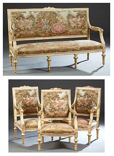 Louis XVI Style Four Piece Carved Giltwood Parlor Suite, 20th c., consisting of three fauteuils and a settee, with rectangular floral carved crest rai