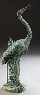 Patinated Bronze Fountain Figure, 20th c., of a crane standing in front of cattails, on an integral circular base, H.- 41 1/2 in., W.- 12 in., D.- 16 