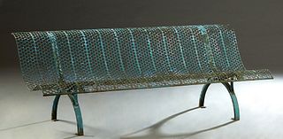 Large French Wrought Iron Garden Bench, 20th c., the canted back and arched seat with pierced circle decoration, on curved wrought iron supports, H.- 