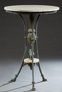 Carved Granite Top Patinated Bronze Tall Garden Table, 20th c., the circular top over a dentillated skirt, on curved tripodal legs with paw feet, join