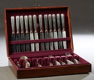 Seventy-Two Piece Set of Sterling Silver Flatware By Buccelatti, 20th c., in the "Old Italian" pattern, consisting of 12 dinner forks, 12 salad forks,