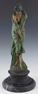 Patinated Bronze Figure of a Woman Disrobing, 20th/21st c., on a stepped figured black marble base, H.- 19 in., Dia.- 7 1/2 in.