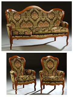 French Louis XV Style Carved Beech Parlor Suite, 20th c., consisting of two fauteuils, and a camelback settee, each with a wide crest rail over a curv