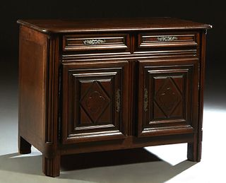 Diminutive French Louis XIII Style Carved Walnut Sideboard, 19th c., the rounded corner and edge top over two frieze drawers with long iron escutcheon
