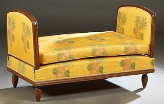 Diminutive French Carved Walnut Daybed, c. 1870, with padded arched sides and a cushioned seat, on reeded tapered legs, in bright yellow fabric with p