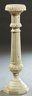 Continental Carved Alabaster Pedestal, late 19th c., the circular top on a stepped reeded columnar support, to a stepped octagonal base, H.- 40 1/2 in